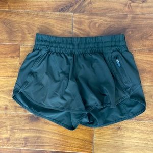 Olive green Lululemon running shorts